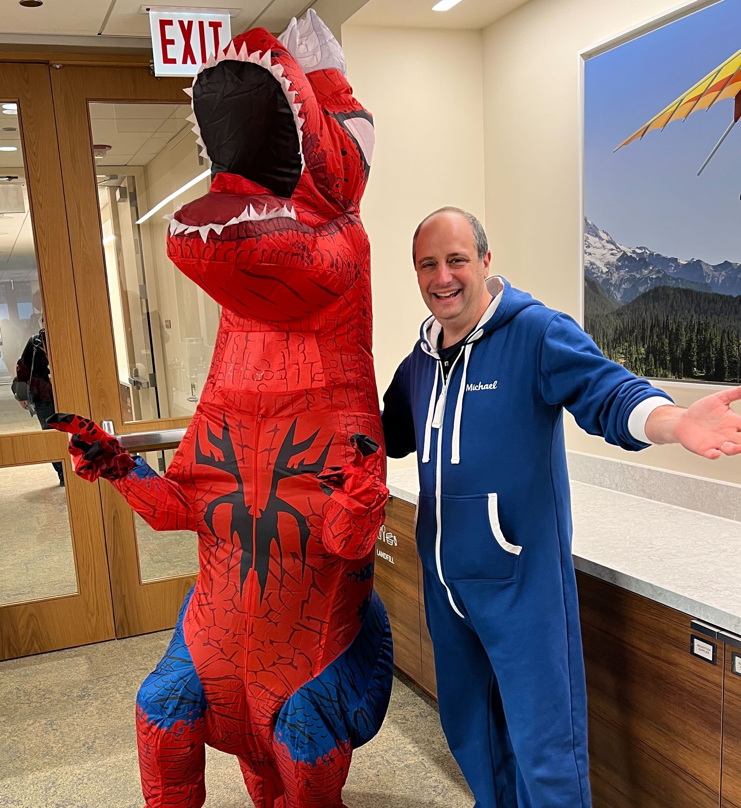 Sprinty the community mascot wearing a Marvel Spider-Rex halloween costume.